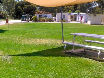Lawn sites are close to the amenities block and camp kitchen