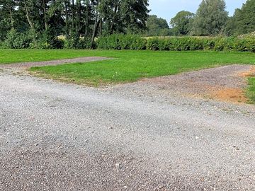 Generous-sized grass and gravel pitch