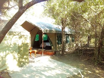 Safari tent, dining space and kitchen