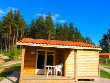 Wooden lodges by the forest