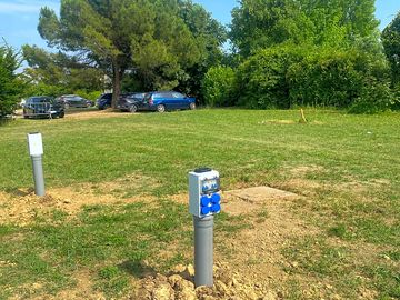 Electric hardstanding and grass pitch