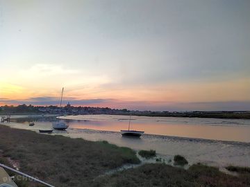 View of boats blackwater estuary, maldon, essex at sunrise