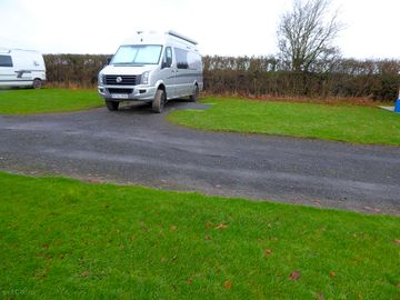 Electric Hardstanding and grass touring pitch