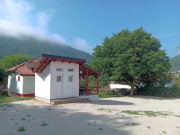 View of the terrain with showers, toilets and a gazebo