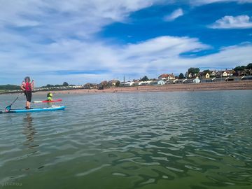 Paddle boarding on the quiet beach