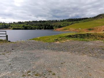 Our camper van pitch located just a stones through from our lake, swim and paddle to your hearts