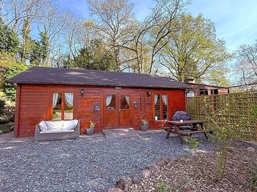 External view, BBQ, bench and seating