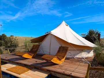 Terrace seating outside the bell tent