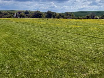 View across field where bus is situated.