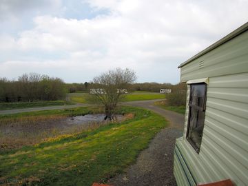 View from front of static caravan towards pond and woody's lake
