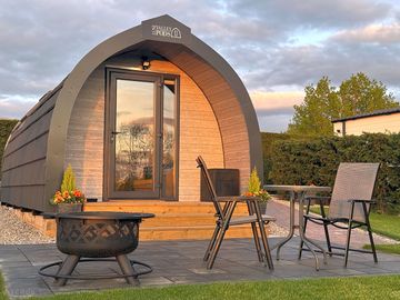 Patio with firepit and patio set at Honey Pod