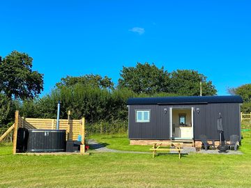 Exterior of hut and hot tub