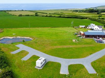 Aerial shot showing the pitches and the pond