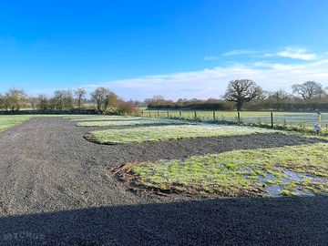 Level hardstanding pitches