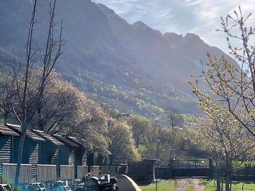 Pitches with a mountain backdrop