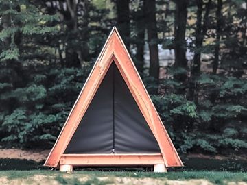 Wooden tent next to the pitch