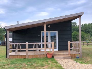 Nightingale Lodge with its private veranda, ideal spot to watch the sunset or star gaze