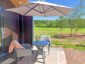 Enjoy the countryside view from your own terrace with parasol for the sun