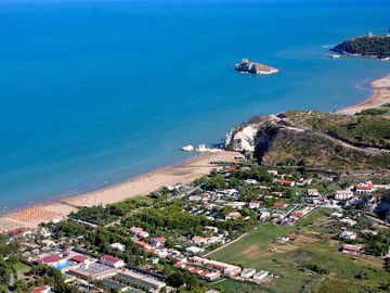 The site is next to a wide sandy beach