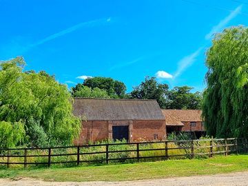 View over the farm pond from the site