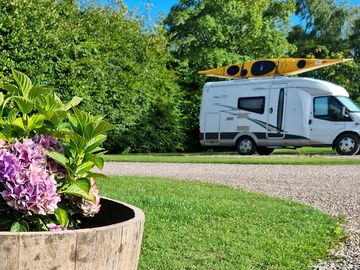 Large gravel touring pitch with electric hook up