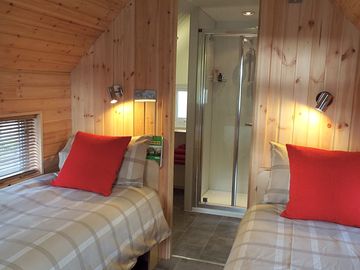 Inside the cabin: comfortable beds, cooking essentials and a shower room