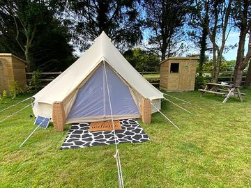 Outside view of what it looks like for your stay in a bell tent
