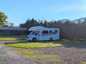 Spacious fully-serviced, hardstanding pitches each with electricity, water and grey-water drain.