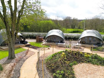 Glamping lodges surrounded by paths