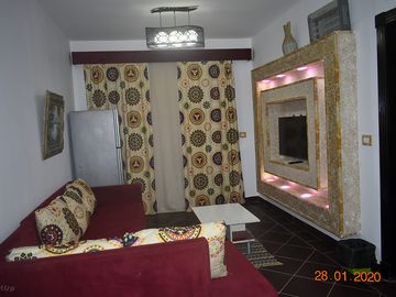 The living room can be used as a room with his 1 sofa-bed.
