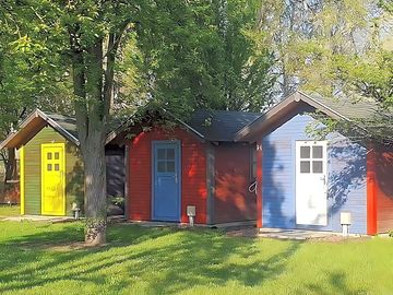Brightly painted cabin exteriors