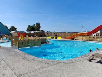 Pool with slide and sun deck