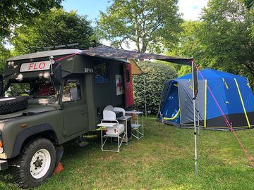 Flo a 1987 military ambulance renovated for a great camping experience.