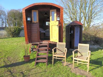 Front of the shepherd's hut with toilet and shower next door