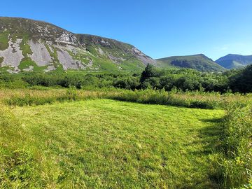 Grass pitch and gyrn ddu mountain