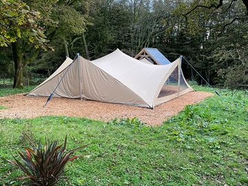 Stretch tent with oak structure for firepit area