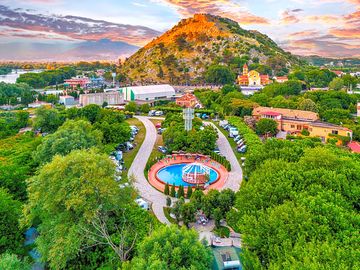 Camping Legjenda – nestled below Rozafa Castle, with pool, nature, and historic charm.