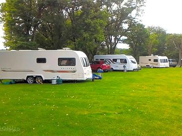 Electric hardstanding and grass pitch