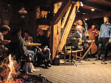Come along listen to or play music in the evening