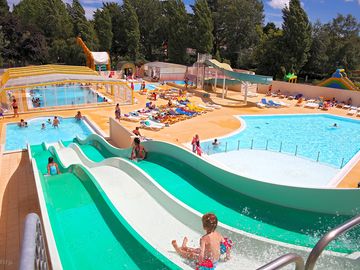 Heated and covered pool, sloping pool, water slides, hot tubs.