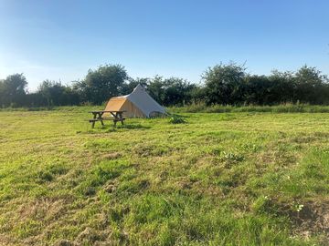 Attractive tent with one of our picnic tables