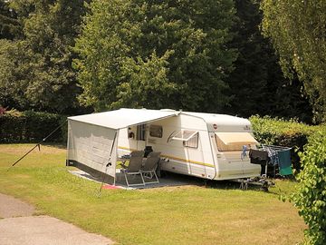 Our spacious pitches are separated by high hedges.