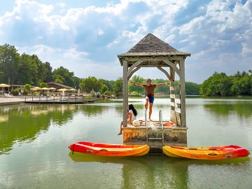 Kayaks and diving platform on the lake