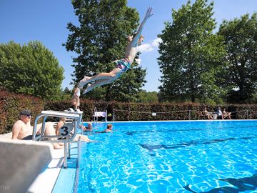 Swimming pool with starting blocks