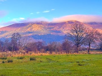 Blue skies and clouds over the fell