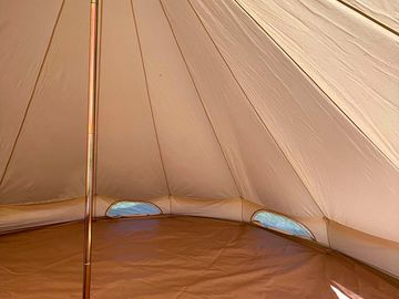 Our unfurnished bell tent, Annie, pre erected for your convenience! Bring your own beds & equipment.