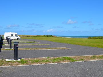 Fully serviced gravel pitches with sea and river views