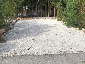 Large pitch with plenty of shade in the summer months. Water and electricity on the pitch.