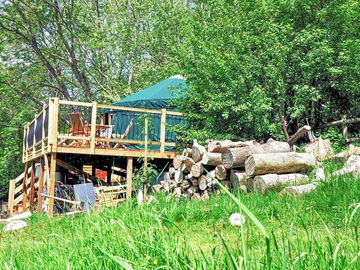 The yurt is on a wooden platform forming a veranda that's great for sunset watching