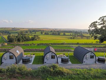 View across the pods to the green countryside